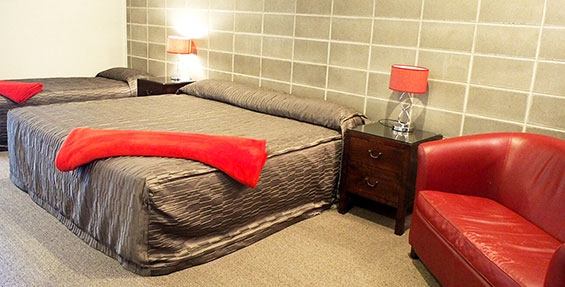 super king-size bed and single bed in studio rooms